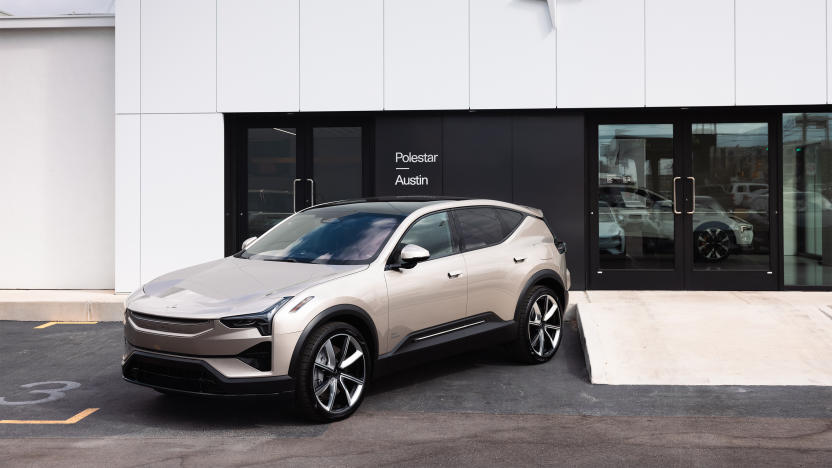 A US-made Polestar 3 electric SUV sitting outside in front of a showroom.