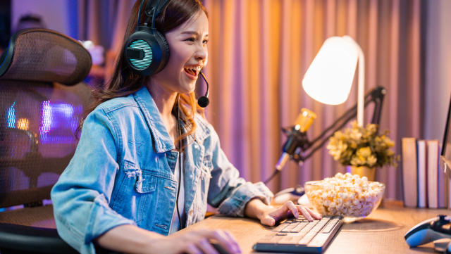 Young eSports woman player competing at an eSports event in her room