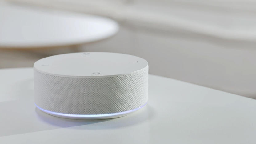 A round puck-like device on a white table.