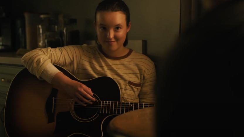 Ellie (Bella Ramsey) playing guitar in The Last of Us.