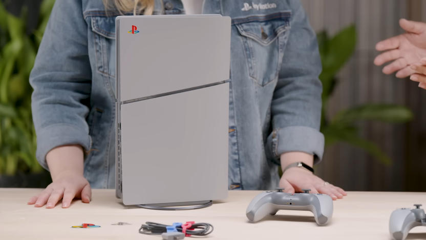 The retro-themed PlayStation 30th Anniversary Bundle sitting on a counter with a person in a jean jacket standing behind.