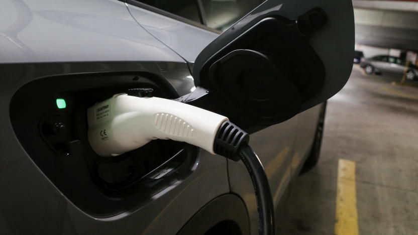 A charging handle recharges a Volkswagen ID.4 electric vehicle (EV) parked at an EV charging station inside a parking garage owned by the City of Baltimore, in Baltimore, Maryland, U.S., March 23, 2023. REUTERS/Bing Guan